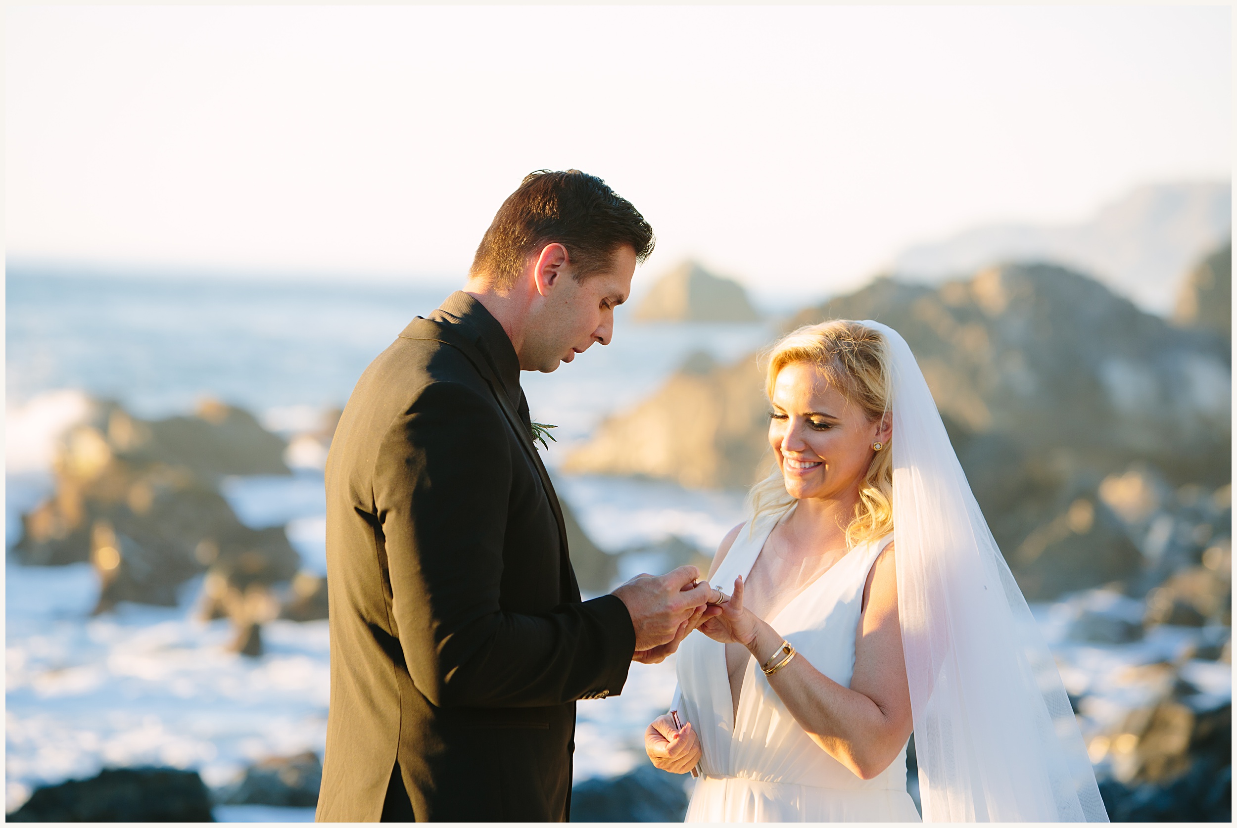 Photo of Bride and groom exchanging wedding rings