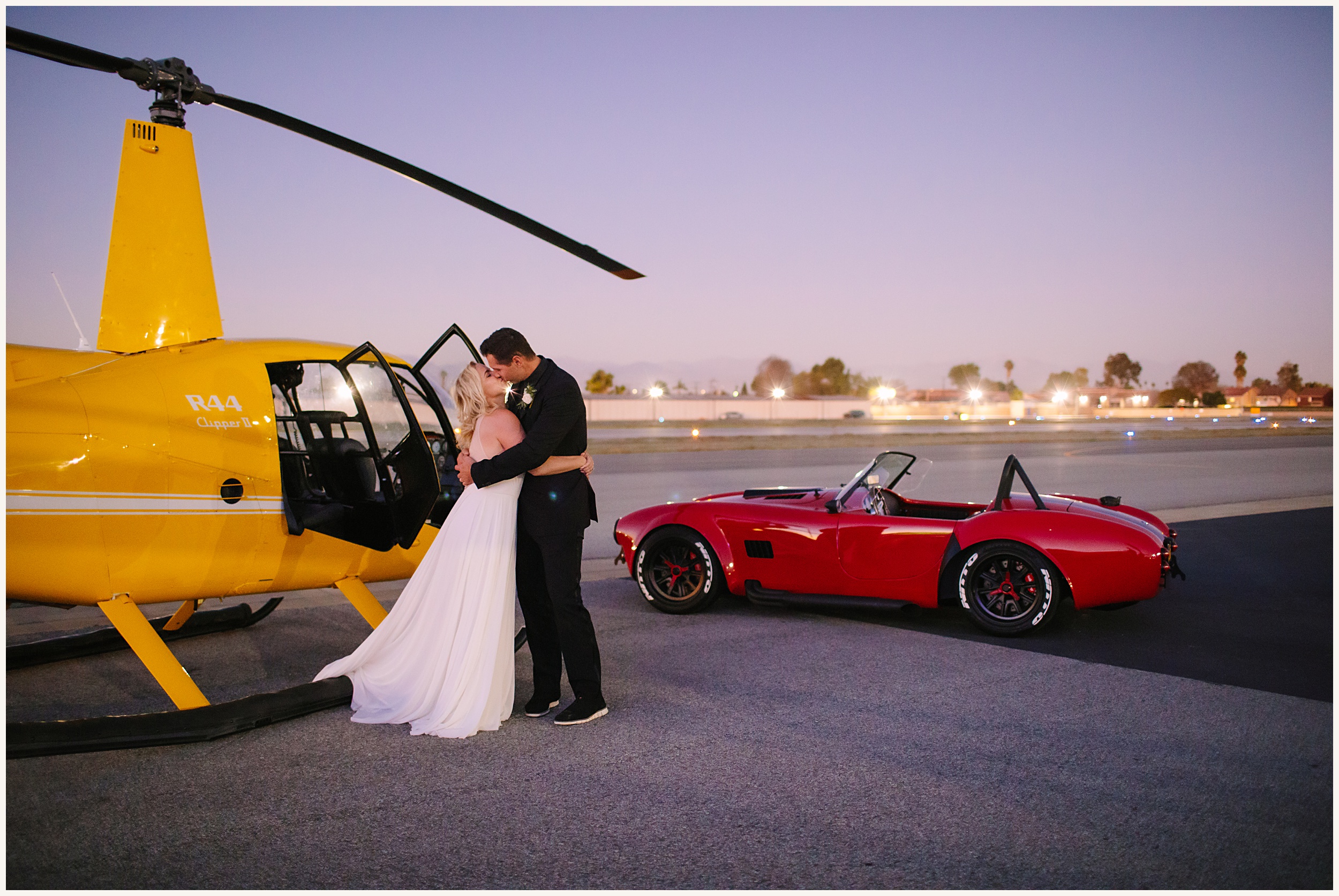 Photo of Bride and groom getting out of yellow helicopter