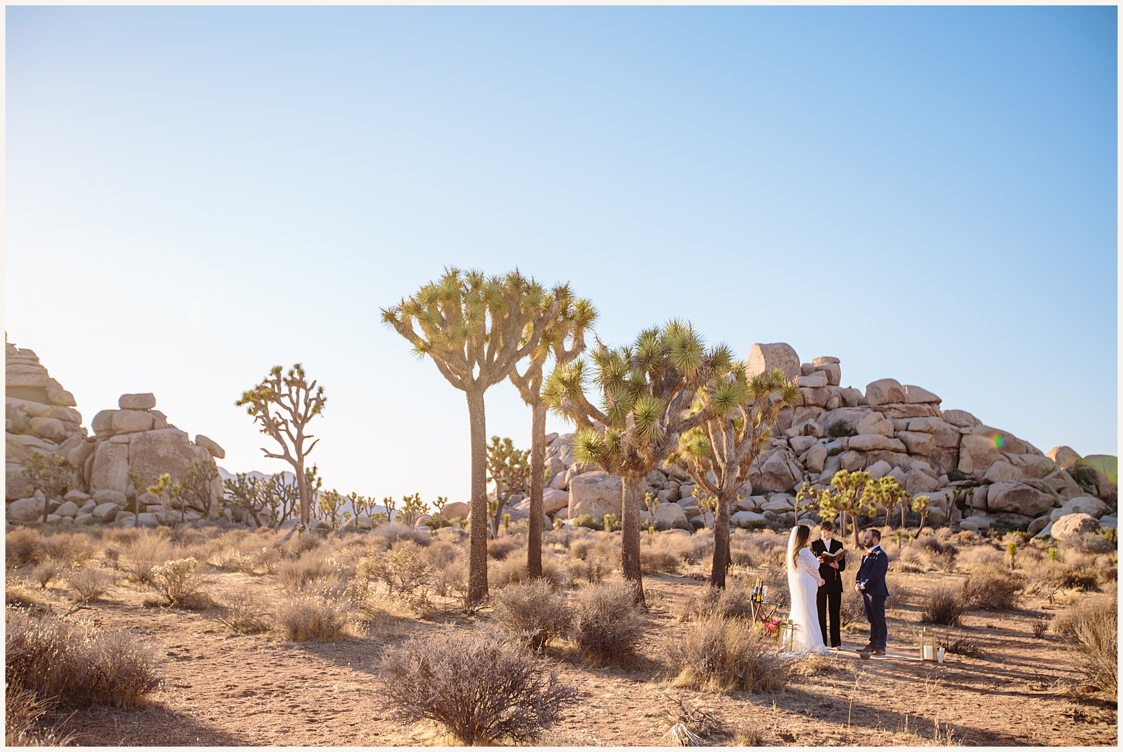 Photo of bride, groom and officiant during elopement cermeony in Joshua Tree