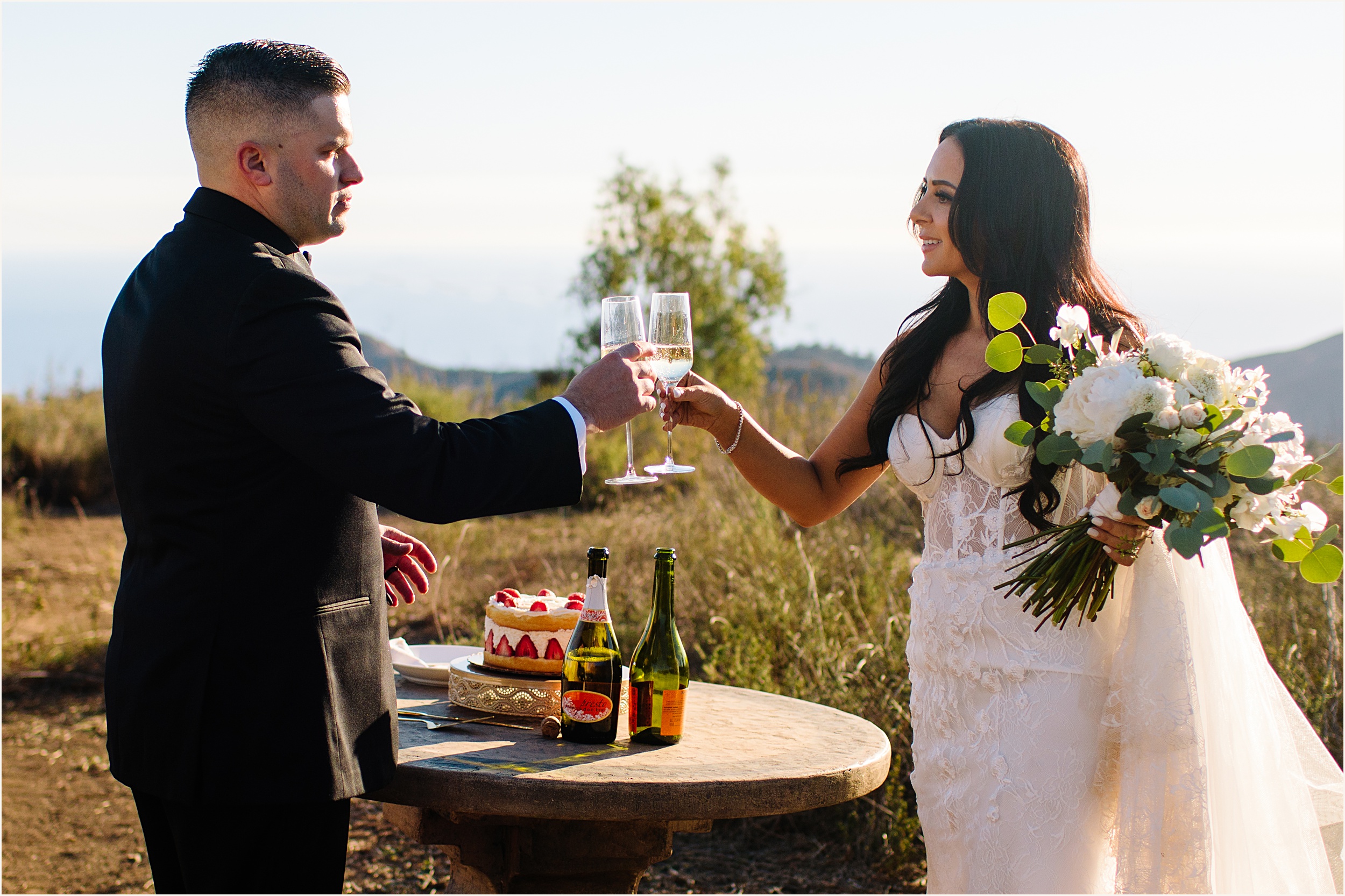 Photo of bride and groom toasting with champagne