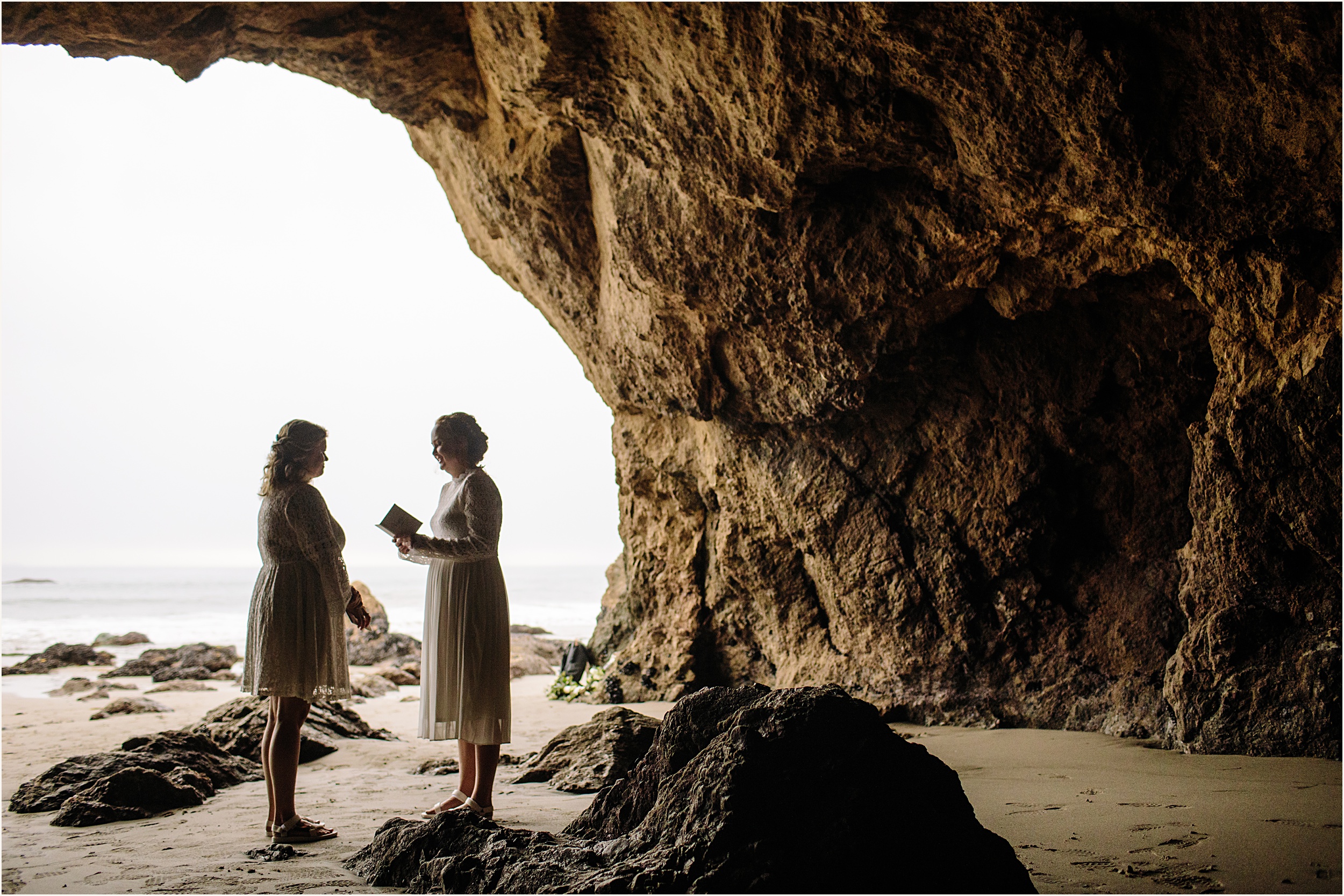 Photo of brides exchanging vows in El Matador beach cave